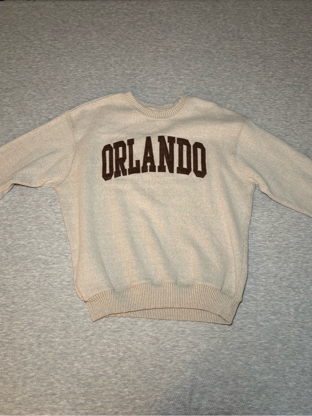 Cream Crewneck Sweater with Brown "ORLANDO" Appliqué